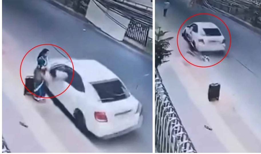 চল ন্ত প্রাইভেটকার থেকে ভ্যানিটিব্যা গে টান, টেনে নিয়ে গেল নারী কে